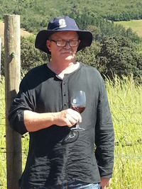 Winemaker Philip Costandius savours a glass of Grenache Noir 2014 